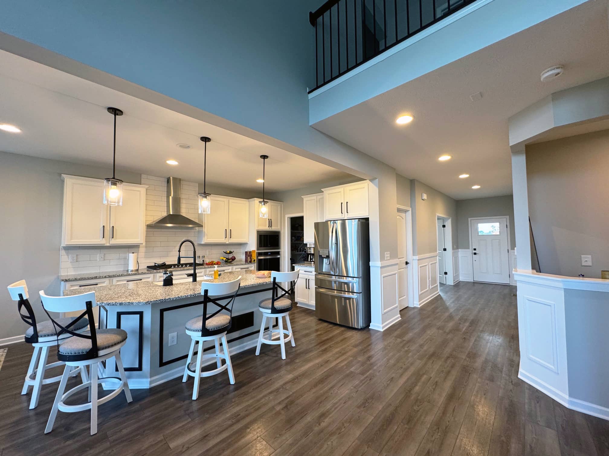 Open-concept kitchen and dining area with hardwood floors in a Gahanna, OH home renovation